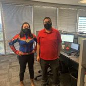 Foto voor GAINSCO: Two employees celebrating customer service week